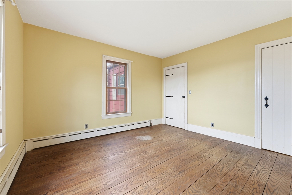 171 Maple Street East Longmeadow, MA 01028 - Photo 19 of 42 an empty room with wooden floor and window