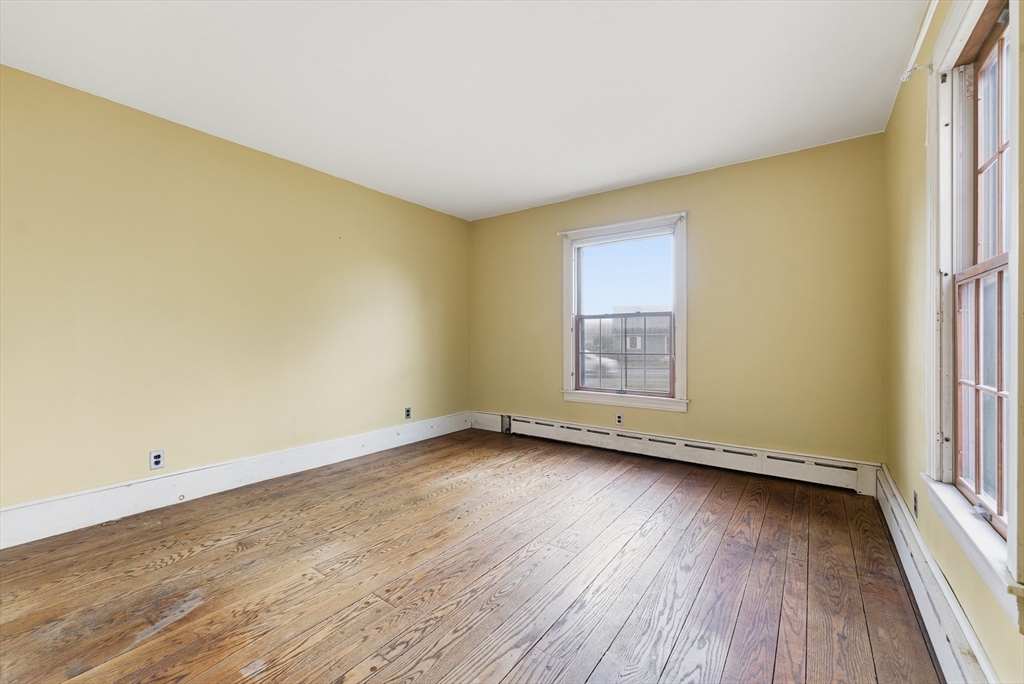 171 Maple Street East Longmeadow, MA 01028 - Photo 20 of 42 an empty room with wooden floor and window