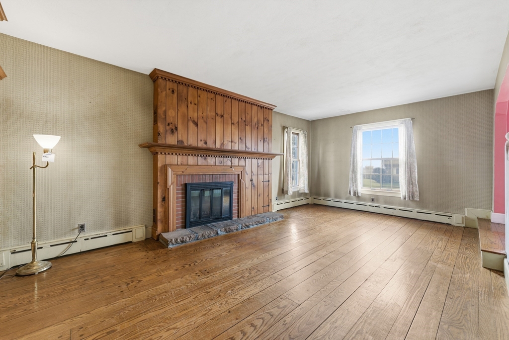 171 Maple Street East Longmeadow, MA 01028 - Photo 22 of 42 wooden floor fireplace and windows in an empty room