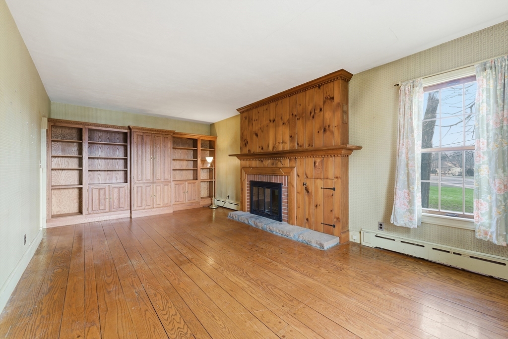 171 Maple Street East Longmeadow, MA 01028 - Photo 23 of 42 a view of a livingroom with a fireplace and a window