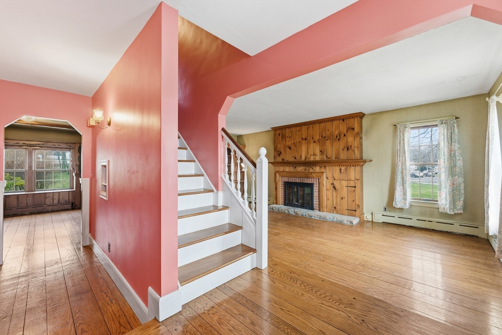 171 Maple Street East Longmeadow, MA 01028 - Photo 25 of 42 a view of a livingroom with wooden floor and fireplace