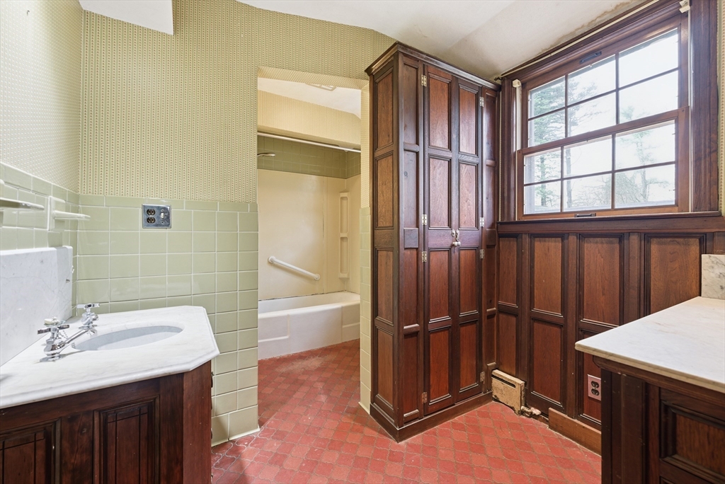 171 Maple Street East Longmeadow, MA 01028 - Photo 26 of 42 a bathroom with a sink a toilet and tub