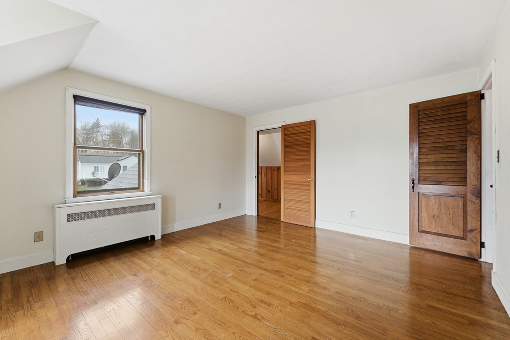171 Maple Street East Longmeadow, MA 01028 - Photo 30 of 42 an empty room with wooden floor cabinet and windows