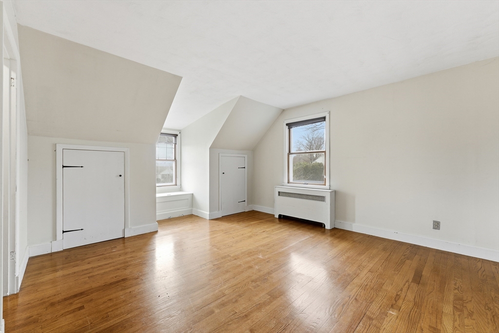 171 Maple Street East Longmeadow, MA 01028 - Photo 32 of 42 an empty room with wooden floor and window