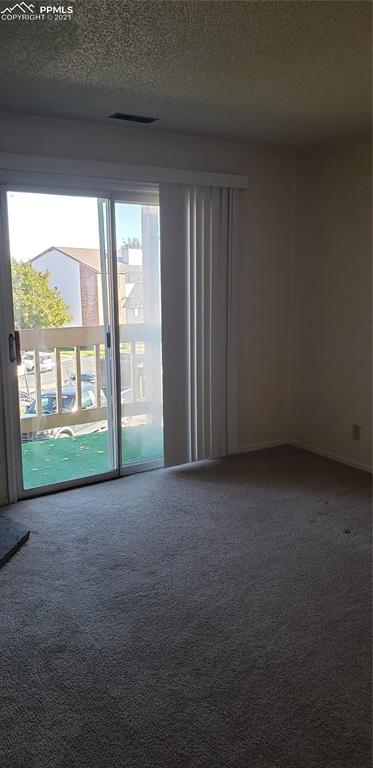 814 Tenderfoot Hill Road, Unit 102 Colorado Springs, CO 80906 - Photo 2 of 11 a view of a room with large windows