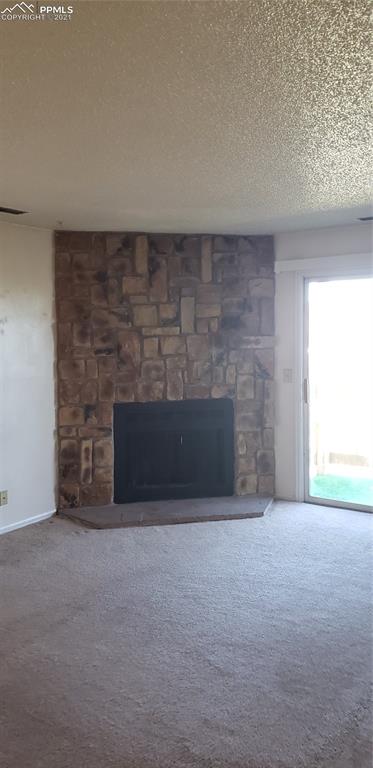 814 Tenderfoot Hill Road, Unit 102 Colorado Springs, CO 80906 - Photo 3 of 11 a view of empty room with a fireplace