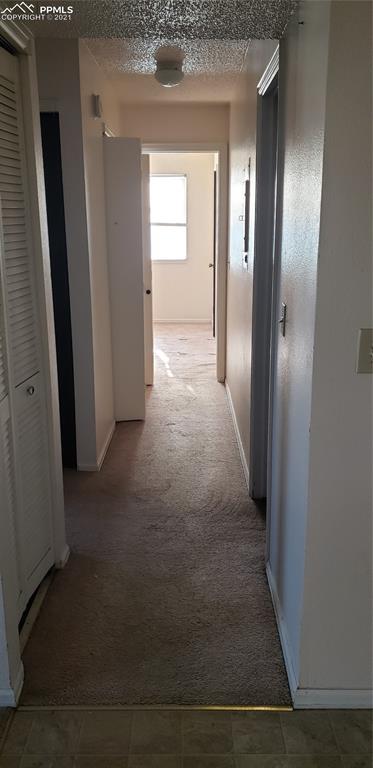 814 Tenderfoot Hill Road, Unit 102 Colorado Springs, CO 80906 - Photo 7 of 11 a view of a hallway