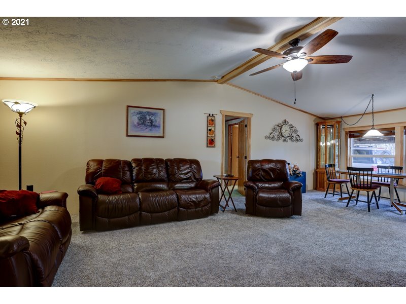 67367 Gist Road Bend, OR 97703 - Photo 2 of 32 a living room with furniture and a fireplace