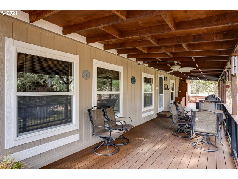 67367 Gist Road Bend, OR 97703 - Photo 18 of 32 a view of a dinning table and chairs in patio of the house