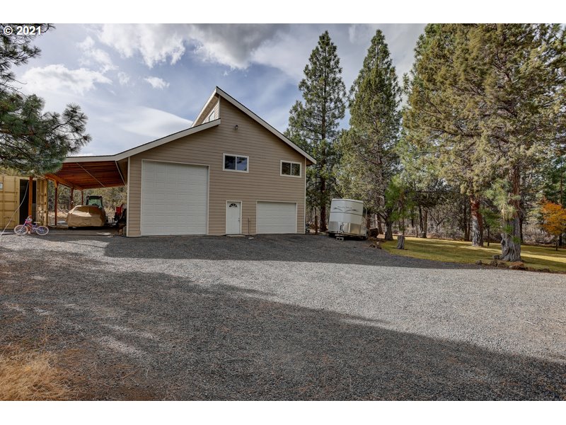 67367 Gist Road Bend, OR 97703 - Photo 21 of 32 a view of a house with a yard and garage