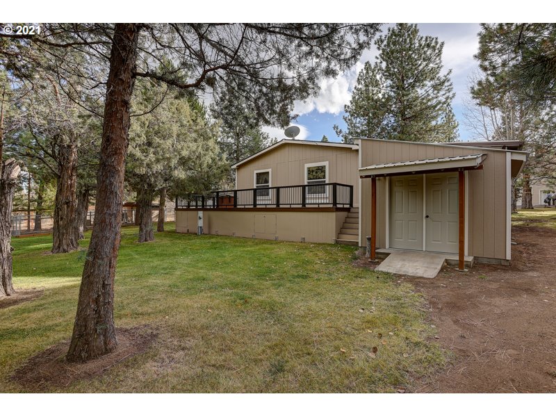 67367 Gist Road Bend, OR 97703 - Photo 28 of 32 a house with trees in the background