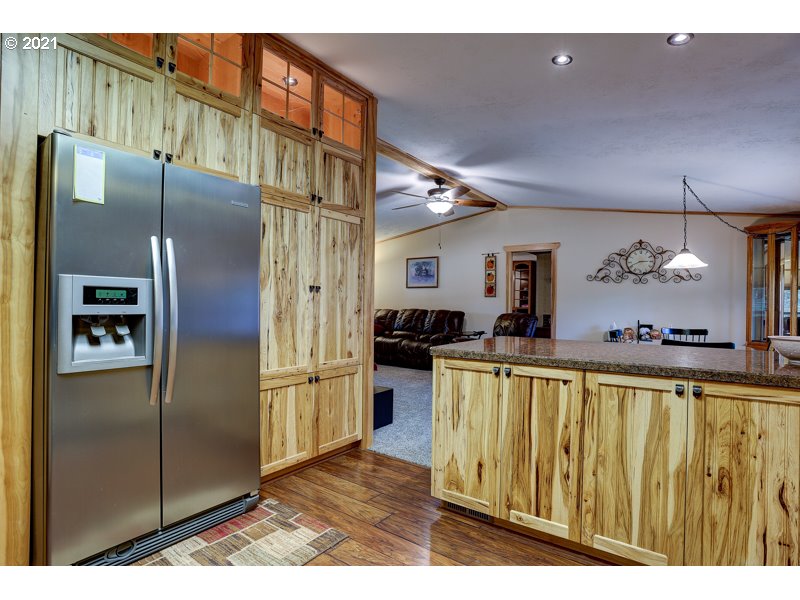 67367 Gist Road Bend, OR 97703 - Photo 7 of 32 a kitchen with stainless steel appliances granite countertop a refrigerator and a sink