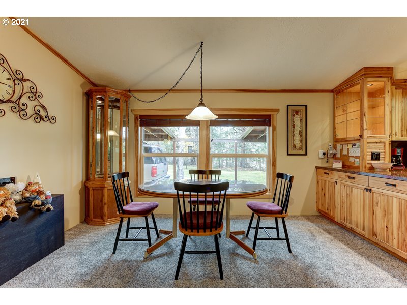 67367 Gist Road Bend, OR 97703 - Photo 8 of 32 a dining room with furniture and window