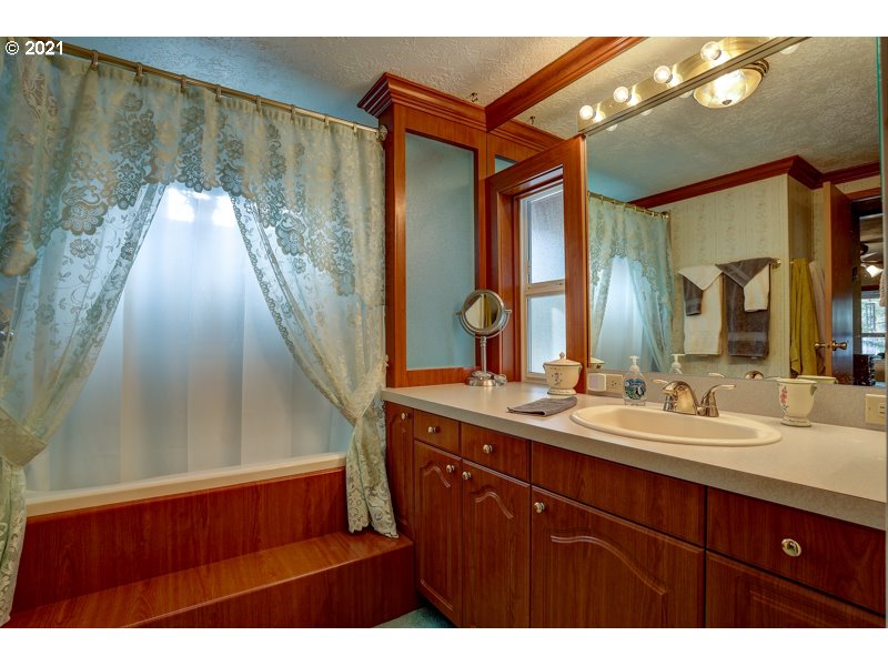 67367 Gist Road Bend, OR 97703 - Photo 10 of 32 a bathroom with a sink and a mirror