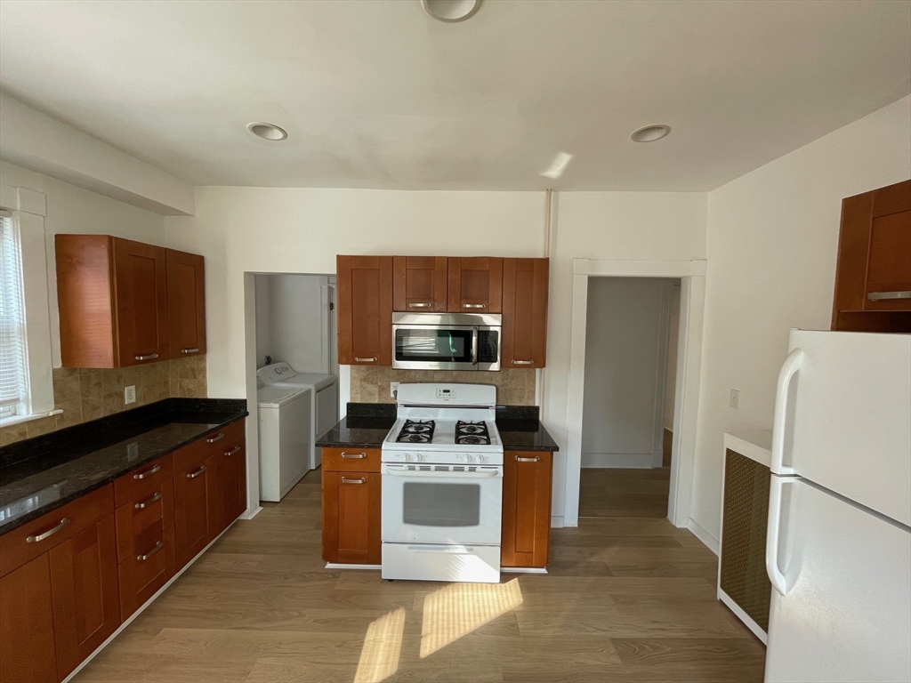 34 Channing Street, Unit 2 Newton, MA 02458 - Photo 19 of 23 a kitchen with a refrigerator stove and sink
