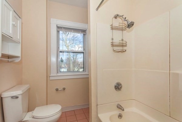34 Channing Street, Unit 2 Newton, MA 02458 - Photo 8 of 23 a bathroom with a sink a toilet and shower