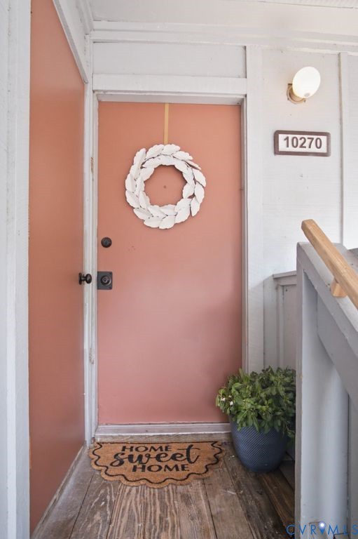 10270 Iron Mill Road Richmond, VA 23235 - Photo 5 of 29 Entryway featuring a peach-toned door, wood-finish