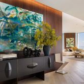 a view of living room filled with furniture and a potted plant
