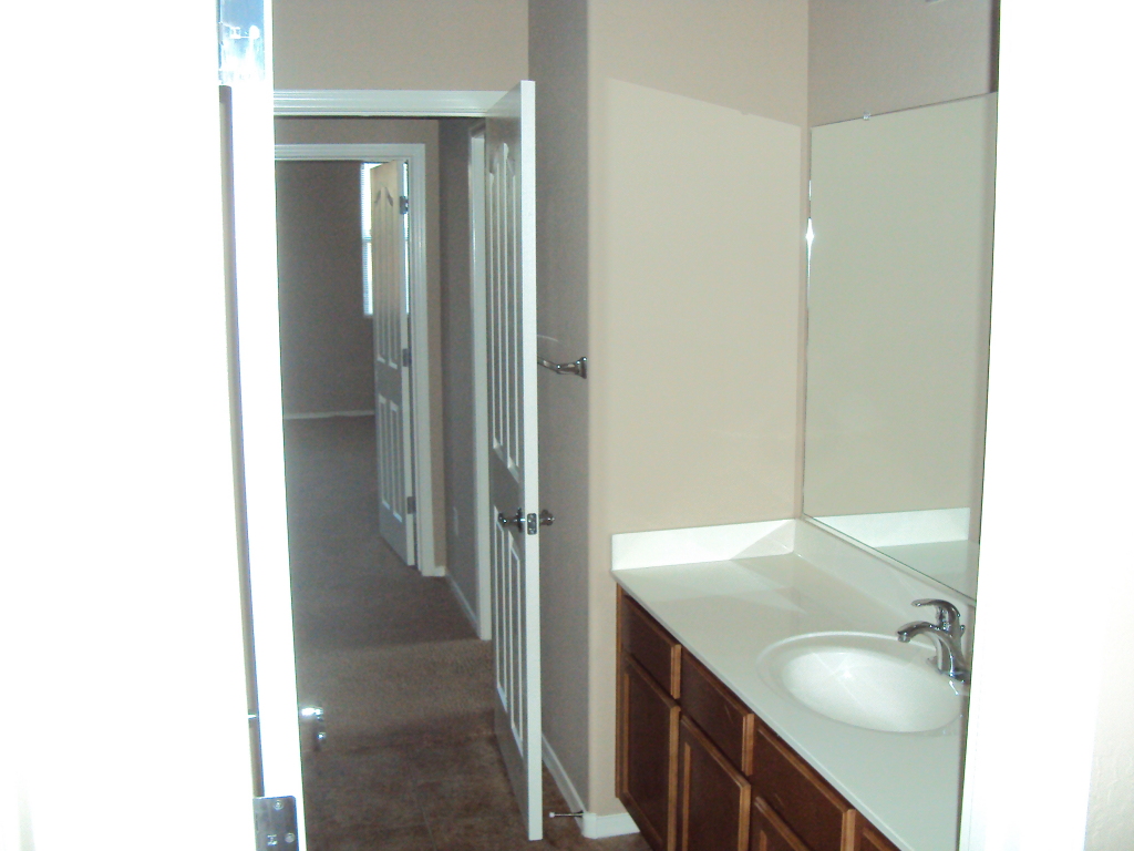 18052 West Hatcher Road Waddell, AZ 85355 - Photo 5 of 9 Jack and Jill Bathroom