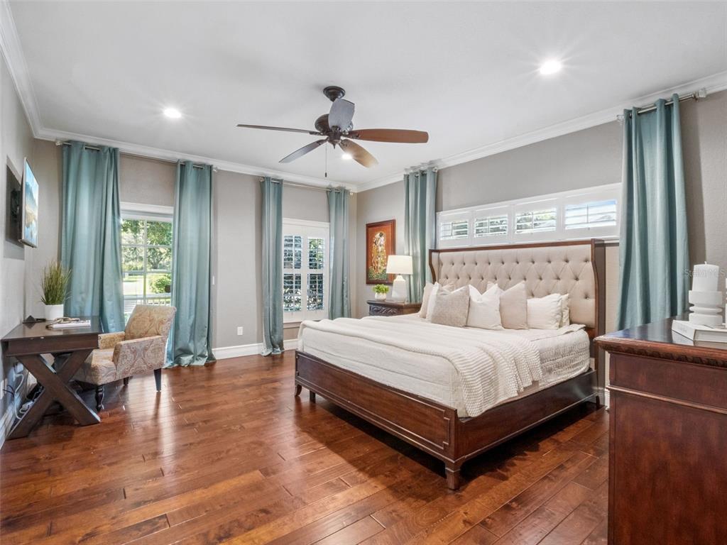 2509 Ridgewind Way Windermere, FL 34786 - Photo 12 of 38 a bedroom with a bed and large windows