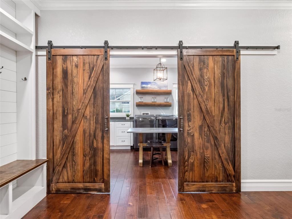 2509 Ridgewind Way Windermere, FL 34786 - Photo 15 of 38 a view of a room with wooden floor and windows