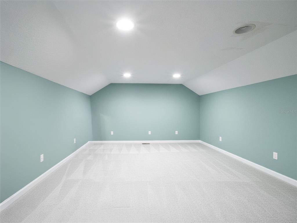 2509 Ridgewind Way Windermere, FL 34786 - Photo 21 of 38 a view of an empty room with a window