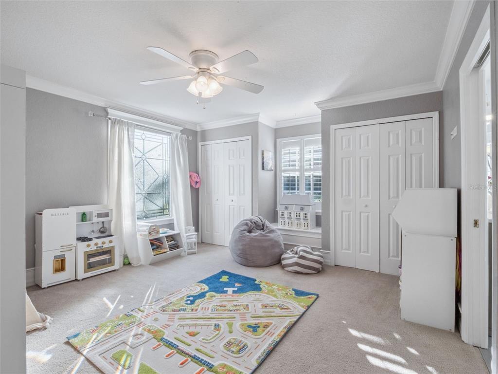 2509 Ridgewind Way Windermere, FL 34786 - Photo 22 of 38 a living room with furniture and a window