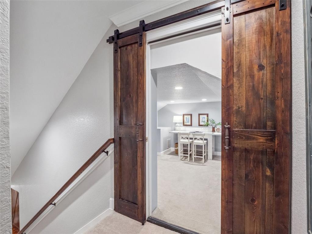 2509 Ridgewind Way Windermere, FL 34786 - Photo 26 of 38 a view of a hallway view with wooden floor and staircase