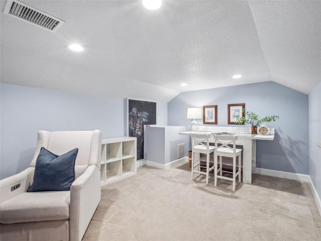 2509 Ridgewind Way Windermere, FL 34786 - Photo 27 of 38 a living room with furniture and a table and chair