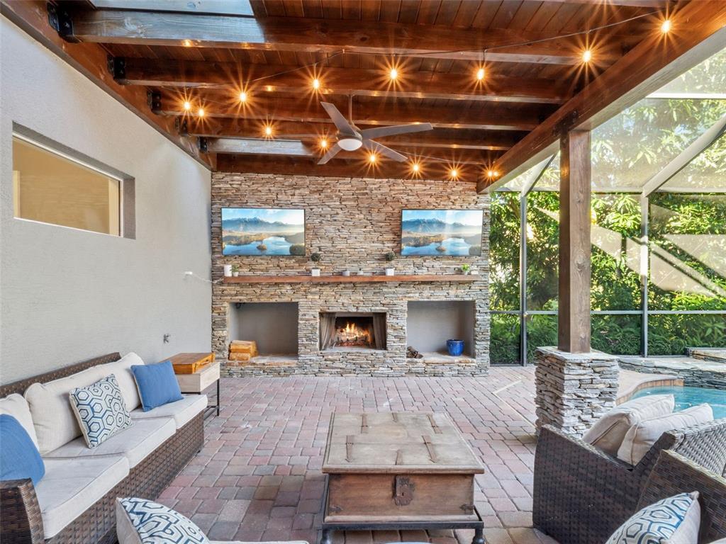 2509 Ridgewind Way Windermere, FL 34786 - Photo 29 of 38 a living room with furniture and a fireplace
