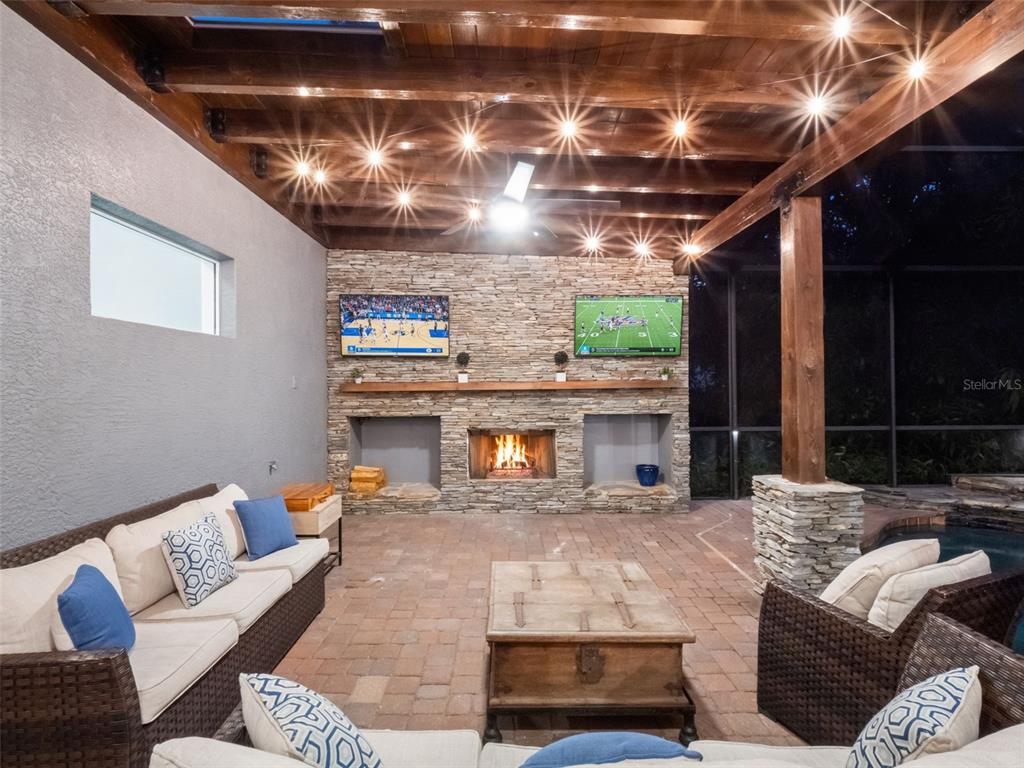 2509 Ridgewind Way Windermere, FL 34786 - Photo 30 of 38 a living room with furniture and a fireplace