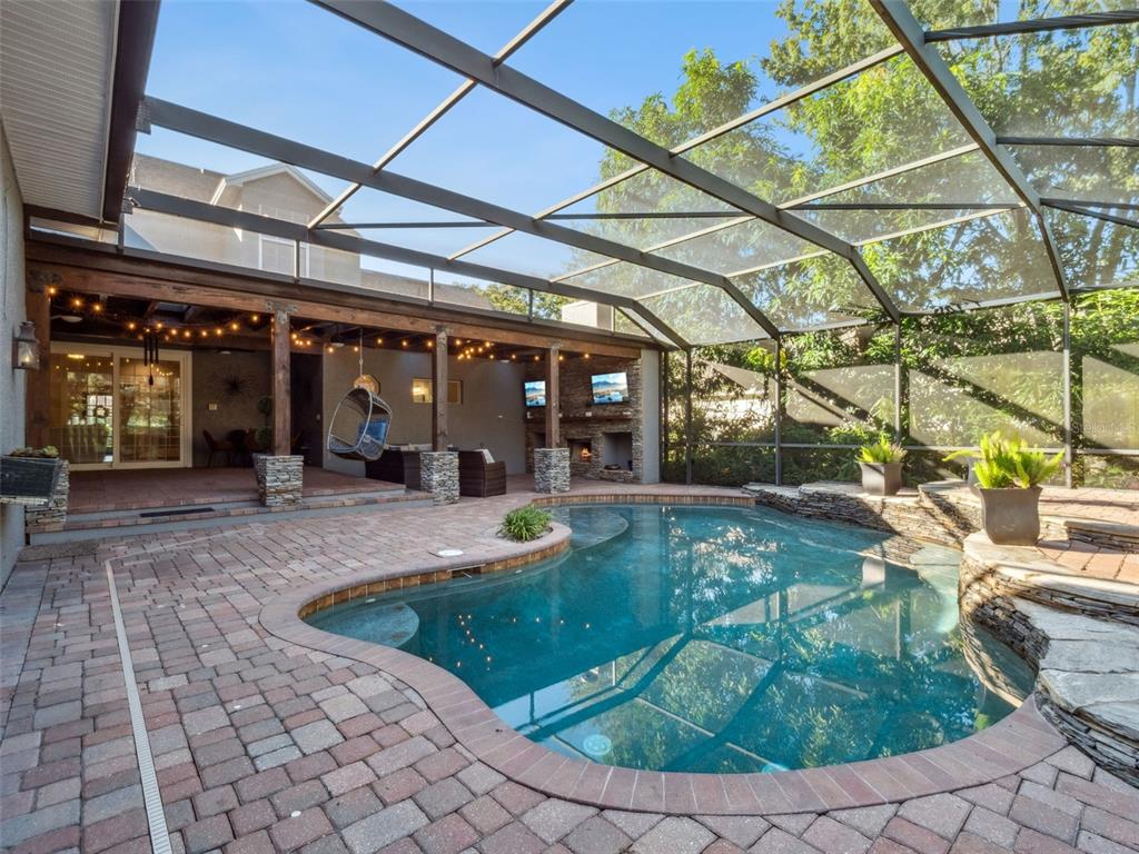 2509 Ridgewind Way Windermere, FL 34786 - Photo 31 of 38 a view of a swimming pool with a patio