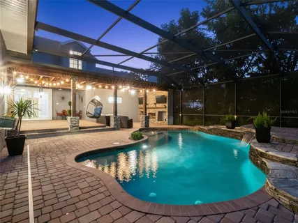 a view of a swimming pool with a patio