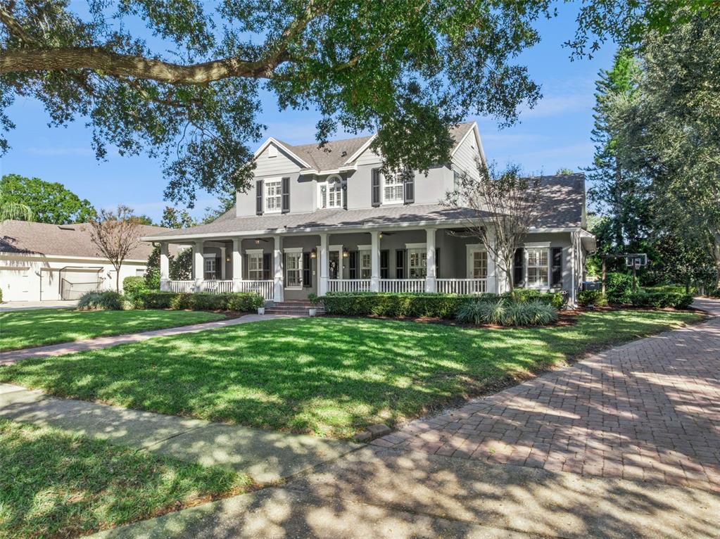 2509 Ridgewind Way Windermere, FL 34786 - Photo 35 of 38 a front view of a house with a garden