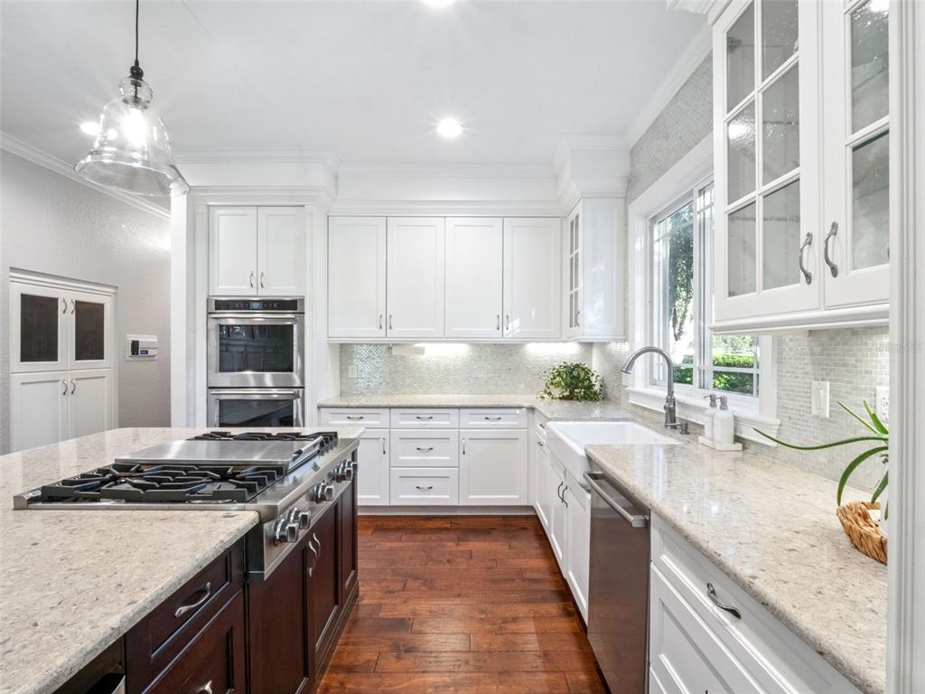 2509 Ridgewind Way Windermere, FL 34786 - Photo 10 of 38 a kitchen with stainless steel appliances granite countertop a stove and a sink