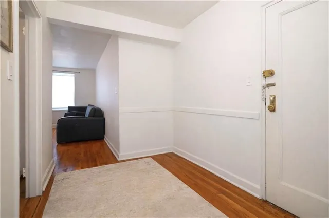 a bedroom with a bed and a mirror