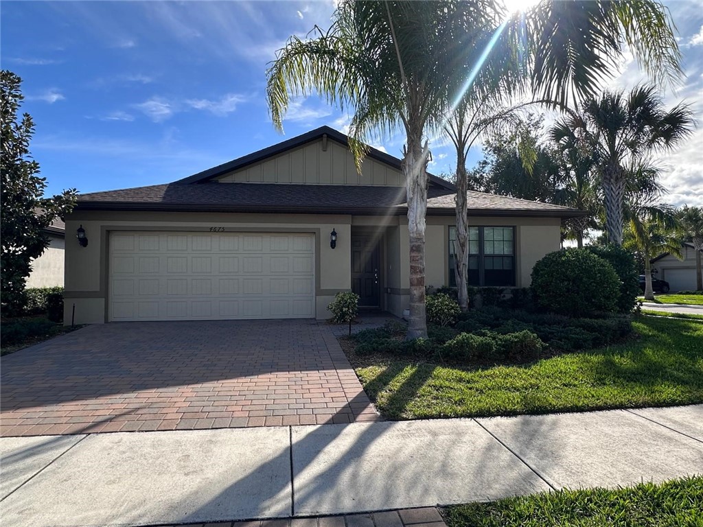 4675 Indigo Way Vero Beach, FL 32967 - Photo 19 of 19 a front view of house with yard and green space