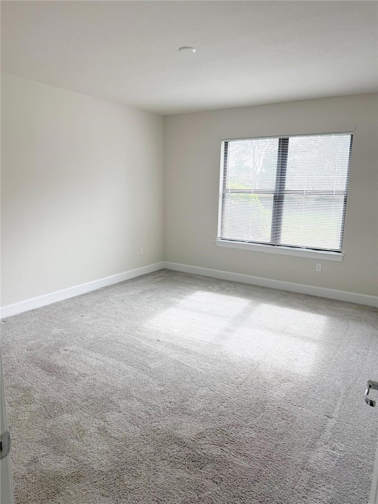 4675 Indigo Way Vero Beach, FL 32967 - Photo 6 of 19 an empty room with a window