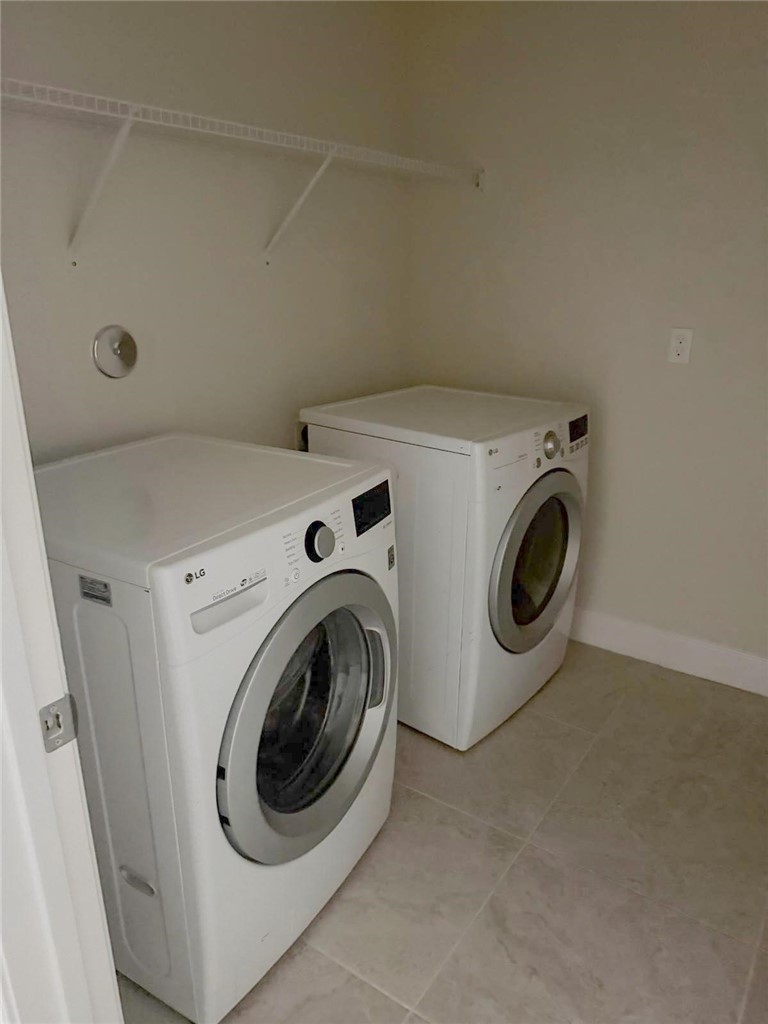 4675 Indigo Way Vero Beach, FL 32967 - Photo 10 of 19 a utility room with dryer and washer