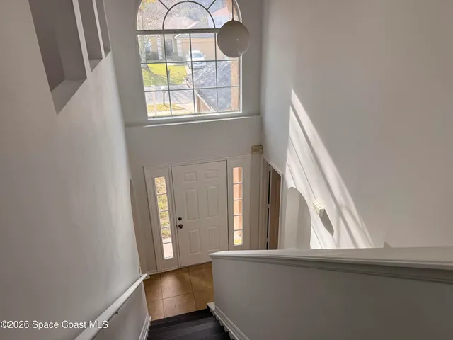 a view of an entryway with wooden floor