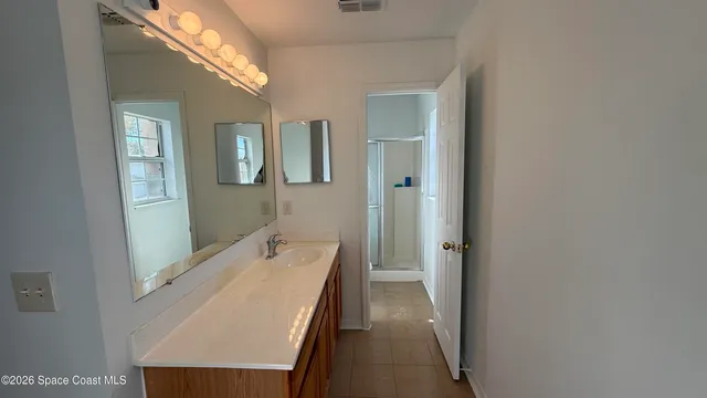 a bathroom with a sink a mirror and a bathtub