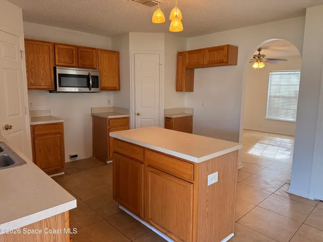a kitchen that has a cabinets and a stove