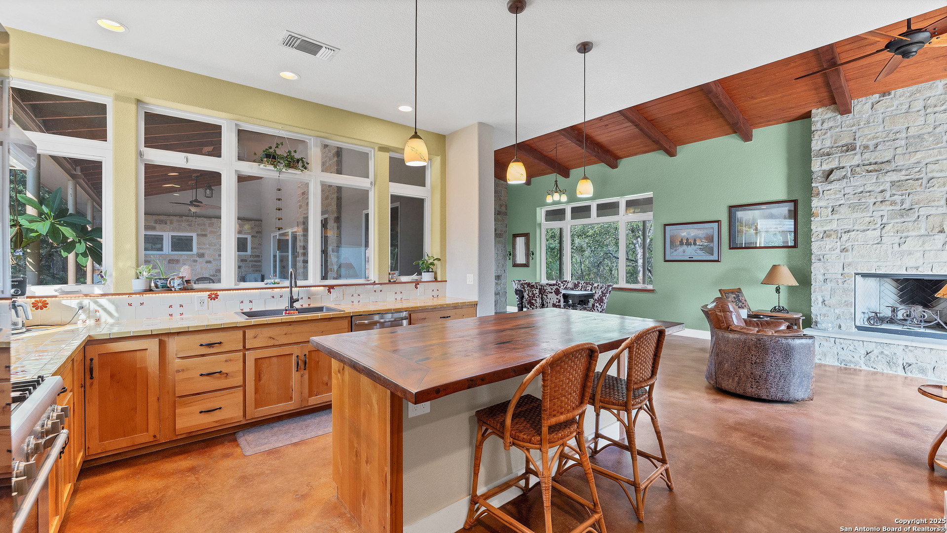 475 Jackson Road Kingsbury, TX 78638 - Photo 15 of 44 a kitchen with a table chairs and a sink