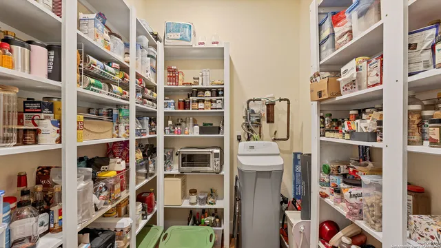 a room with furniture and a book shelf