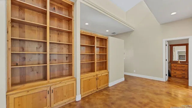 a view of an empty room with a closet