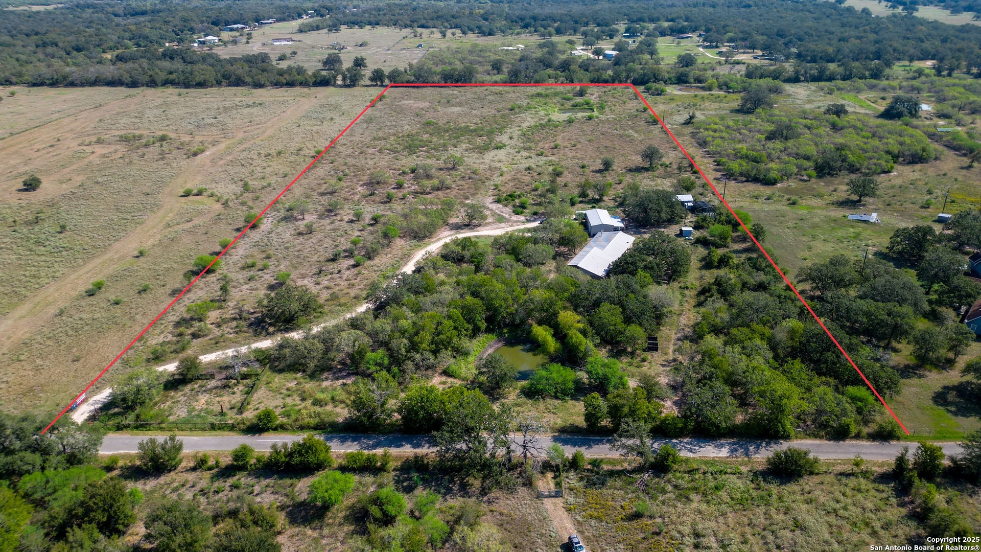 475 Jackson Road Kingsbury, TX 78638 - Photo 2 of 44 an aerial view of house with yard and outdoor seating