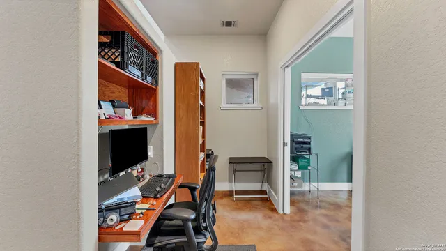 a room that has a dresser and a chair in it