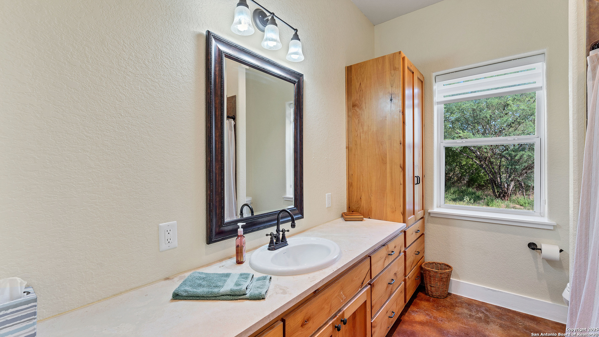 475 Jackson Road Kingsbury, TX 78638 - Photo 28 of 44 a bathroom with a granite countertop sink and a mirror