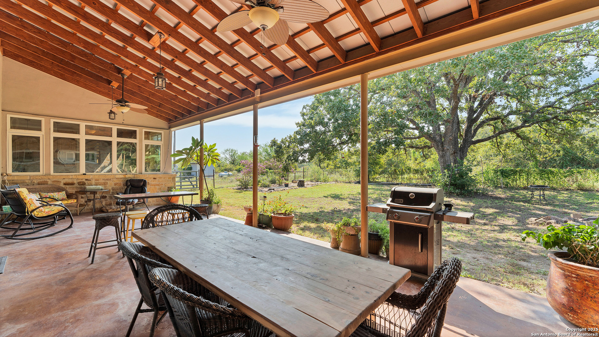 475 Jackson Road Kingsbury, TX 78638 - Photo 35 of 44 a outdoor dining space with furniture and wooden floor