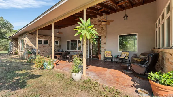 a backyard of a house with outdoor seating